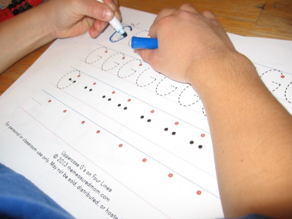 在第三层纸上写出字母G